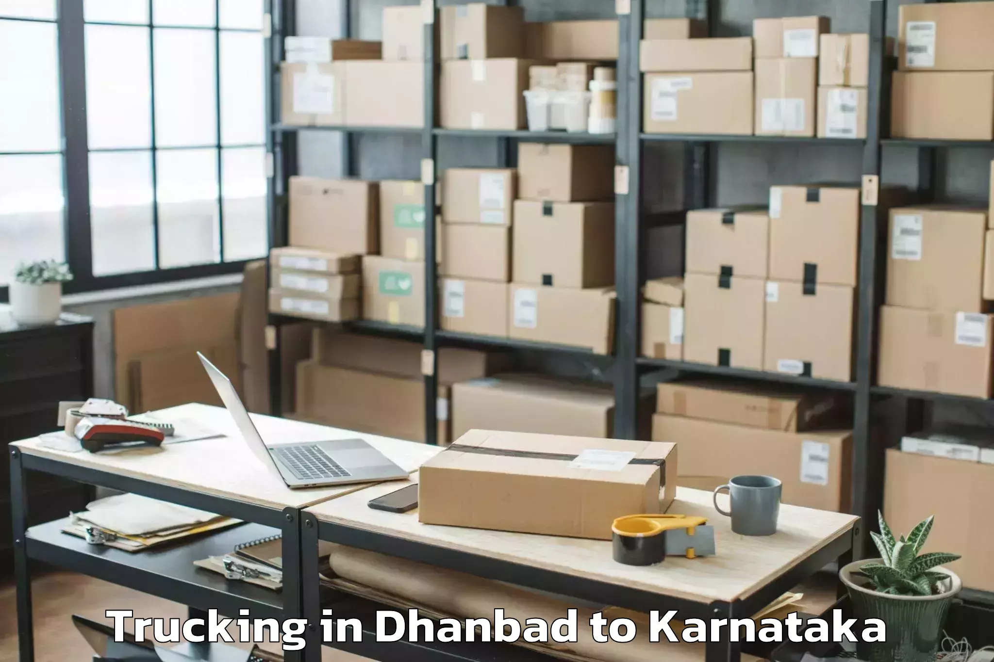 Leading Dhanbad to Krishnarajanagara Trucking Provider